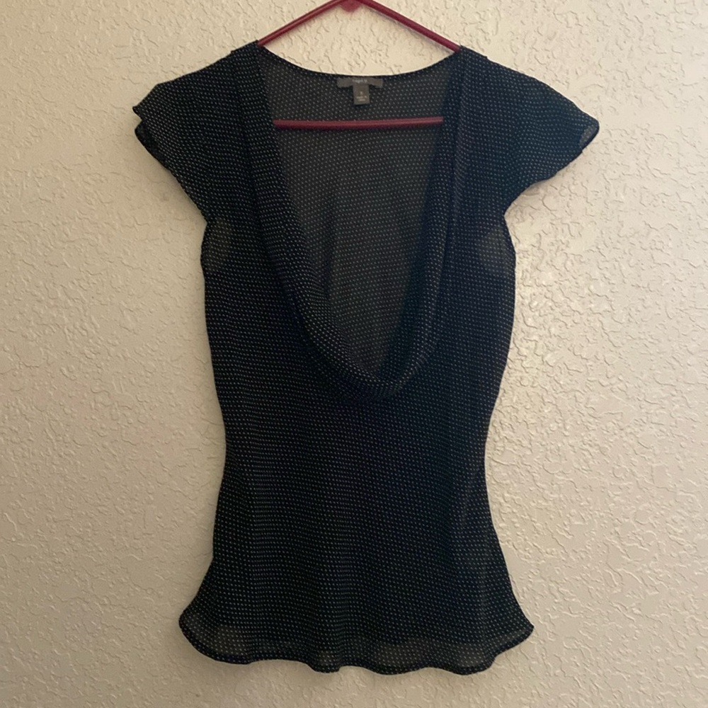 Woman’s black and white polka dot blouse, material is polyester size s